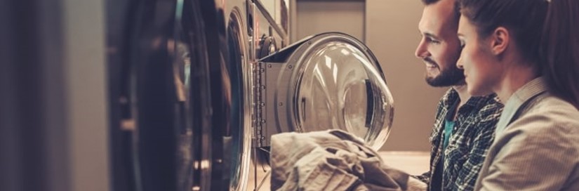 Couple Loading Washing Machine Min